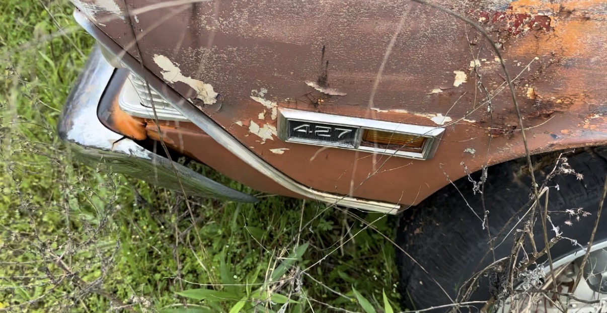 Original weathered 427 fender badge