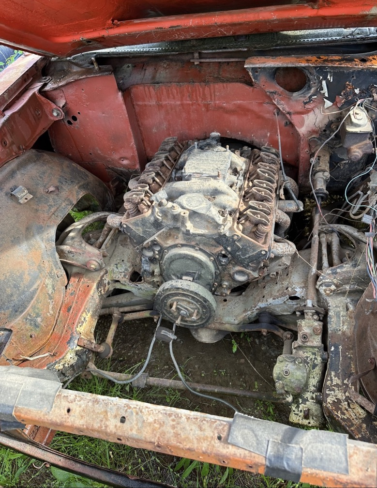 The Chevelle's dusty engine bay